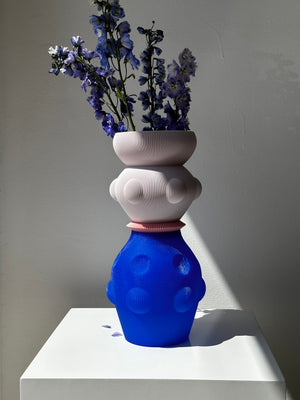 LVASE01VASEBYUAUPROJECTELECTRICBLUEANDPASTELPURPLE2 WITH FLOWERS